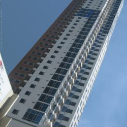 8 Adriatico's exterior is painted brown and white with evenly distributed glass windows. This is 8 Adriatico as seen from J. Bocobo St. near Padre Faura St.