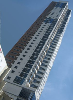 8 Adriatico's exterior is painted brown and white with evenly distributed glass windows. This is 8 Adriatico as seen from J. Bocobo St. near Padre Faura St.