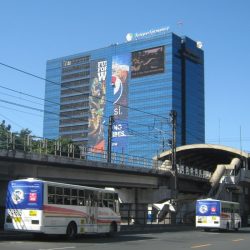 Alphaland Southgate Tower is a cuboid building covered primarily with blue glass panels and some billboards. This picture was taken while riding a bus approaching Chino Roces on the southbound side of EDSA.