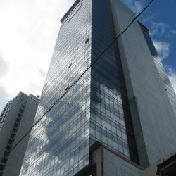 View of Atlanta Centre when one look up while standing on the sidewalk on its side opposite to Beverly Condominium.