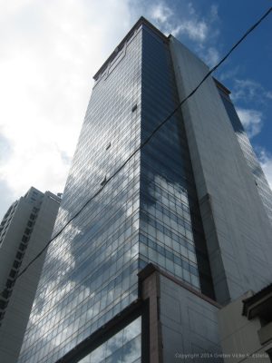 View of Atlanta Centre when one look up while standing on the sidewalk on its side opposite to Beverly Condominium.