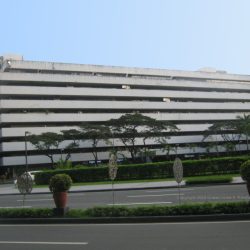The Atrium of Makati's facade is concrete. It features horizontal bands of recessed areas on each floor where the windows are located. This is the view of the Atrium of Makati from the sidewalk at the corner of Paseo de Roxas and Villar St.
