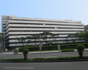 The Atrium of Makati's facade is concrete. It features horizontal bands of recessed areas on each floor where the windows are located. This is the view of the Atrium of Makati from the sidewalk at the corner of Paseo de Roxas and Villar St.
