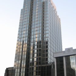 Ayala Life FGU Center - Makati is a bronze-colored building with an exterior covered by glass panels. It looks like two obelisks put side-by-side. This picture is seen from within the car park between Makati Sky Plaza and Jaka Tower on the opposite side of Ayala Ave.