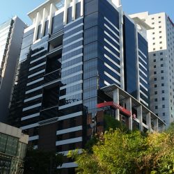 The Bench Tower is a high-rise building with a facade made mostly of blue glasses.
