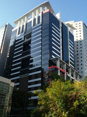 The Bench Tower is a high-rise building with a facade made mostly of blue glasses.