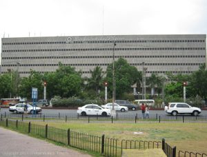 View of a Banko Sentral ng Pilipinas (Central Bank of the Philippines) building as seen from ASEAN Garden (foreground). The road between the central bank and the ASEAN Garden is Roxas Boulevard.