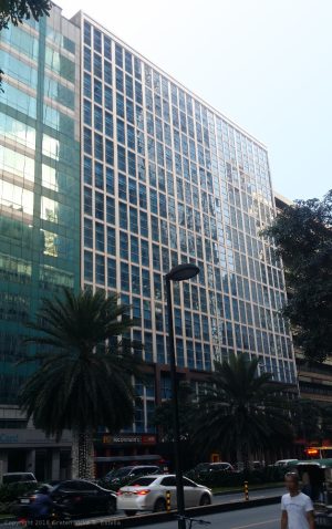 The 6780 has a cube-like shape with a facade of concrete or steel that holds panels of blue-green glass windows.