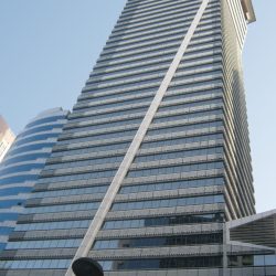 LKG Tower is a skyscraper with a unique diagonal support beam. Photo was taken while standing on the sidewalk on the opposite side of Ayala Avenue.