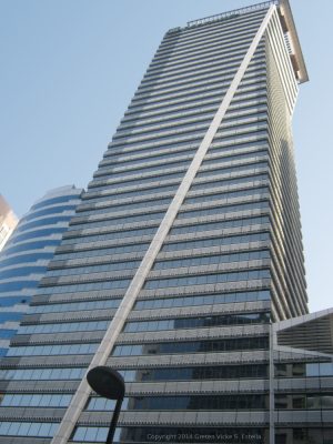 LKG Tower is a skyscraper with a unique diagonal support beam. Photo was taken while standing on the sidewalk on the opposite side of Ayala Avenue.