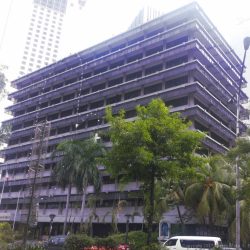 Ortigas Building is a low-rise 10-story building; this picture was taken from the island dividing the two sides of Meralco Avenue. Each floor from 2nd to 10th floor has rows of glass windows and concrete walls with an overhead design made of glass panels mounted on horizontal metal beams. The ground floor has glass and concrete walls with a concrete protrusion that can serve as cover to those standing in front of it. The words ORTIGAS BUILDING in a gray metallic material is seen on the front center of this concrete protrusion above the main entrance.