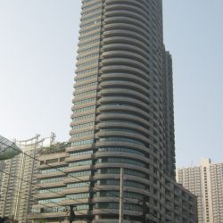 Paragon Plaza with curved architecture and horizontal line patterns. Shot from the EDSA southbound side while riding a bus passing by Petron station across Avida Towers Centera.