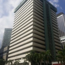 Strata 2000 is a high-rise building with a facade of alternating horizontal bands of white concrete and recessed glass windows.