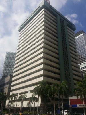 Strata 2000 is a high-rise building with a facade of alternating horizontal bands of white concrete and recessed glass windows.