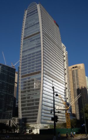 The Finance Center is an oval-shaped skyscraper with a facade of several glass panels on all sides.