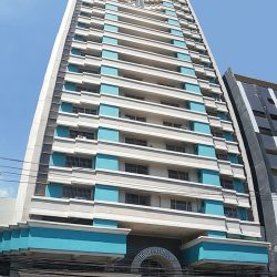 The Platinum 1000 building has a facade of alternating balconies and recessed walls. The arc above the main entrance bears the signage The Platinum 1.