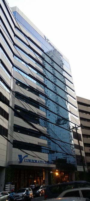 V Corporate Center is a building with wide frontage and is literally V in shape; only half of the V is visible in this picture.